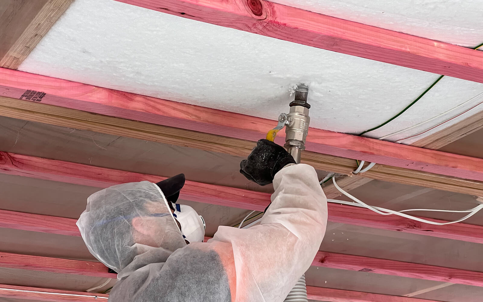 Safe-R Installer blowing underfloor insulation