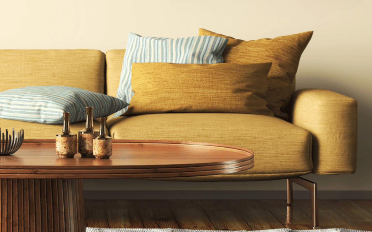 A photo of a mustard couch in a healthy home