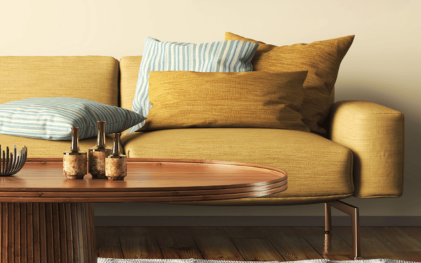 A photo of a mustard couch in a healthy home