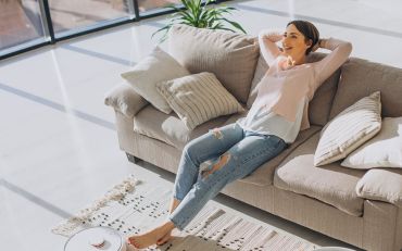 Women on couch enjoying good home ventilation